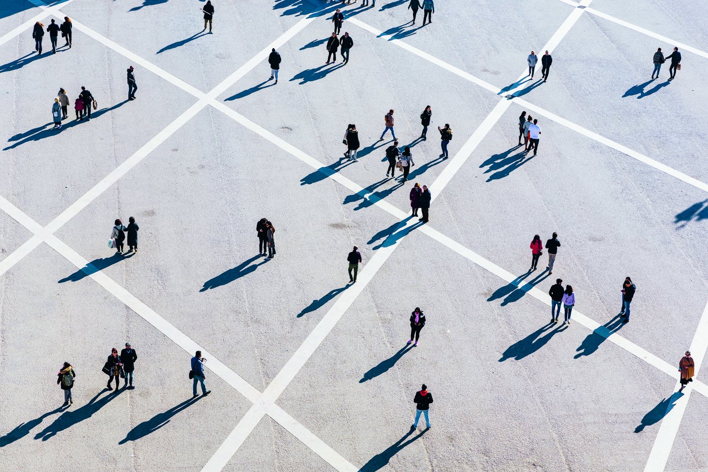 People walking at the town square on a sunny day